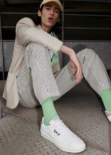 White leather sneakers with navy blue leather details