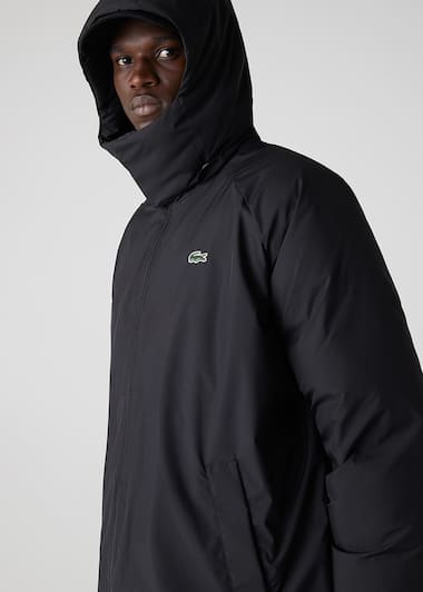 Puffer coat with an enveloping hood and high collar