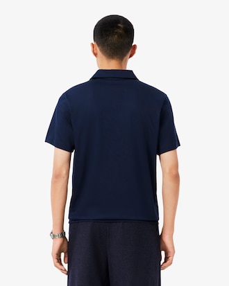 Polo Paris corte cl&aacute;sico cuello abierto bordado