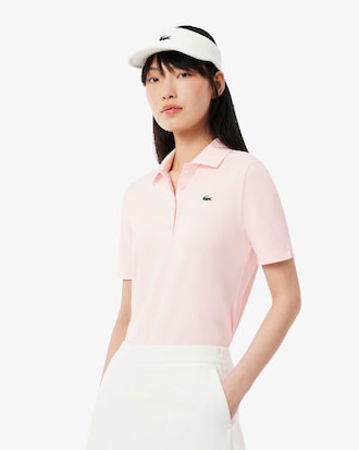 Polo de golf elástico con protección UV y corte entallado para mujer