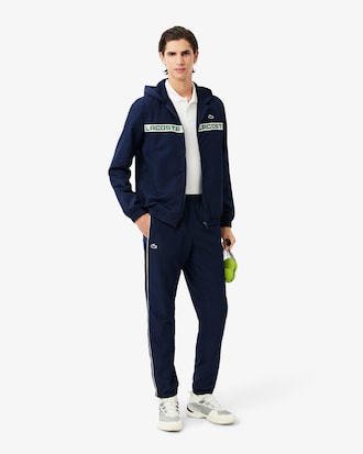 Conjunto deportivo de tenis con franjas con logo