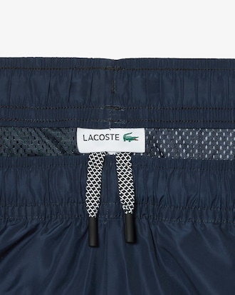 Pantal&oacute;n deportivo de hombre Lacoste con estampado de tablero
