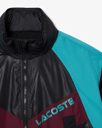 Chamarra oversized color block con gorro y cintura ajustable