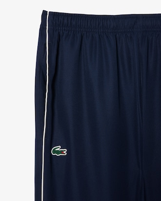 Conjunto deportivo de tenis con franjas con logo