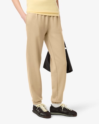 Pantalon molleton logo emboss&eacute;