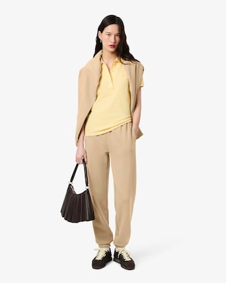 Pantalon molleton logo emboss&eacute;