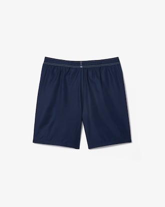 Shorts deportivos de tenis con rayas y logo