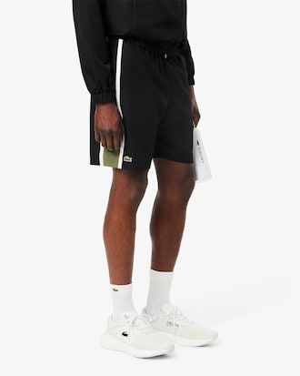 Shorts de tenis ligeros con rayas color block para hombre