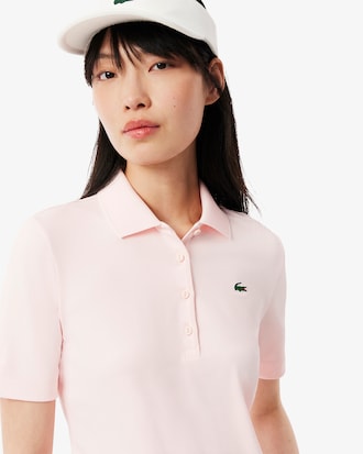 Polo de golf elástico con protección UV y corte entallado para mujer