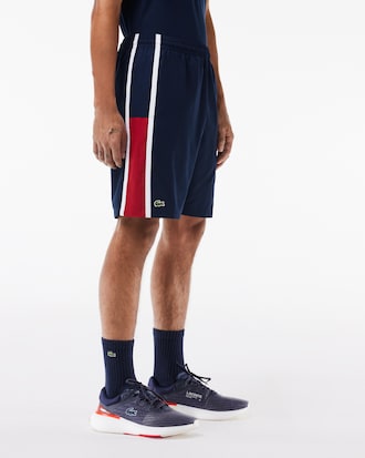 Shorts de tenis ligeros con rayas color block para hombre