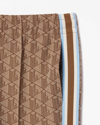 Pantalones deportivos acampanados con monograma para mujer