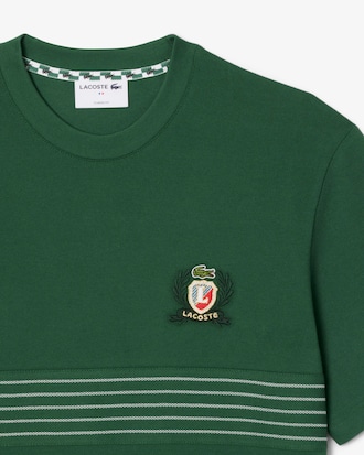 Playera de piqué con escudo bordado