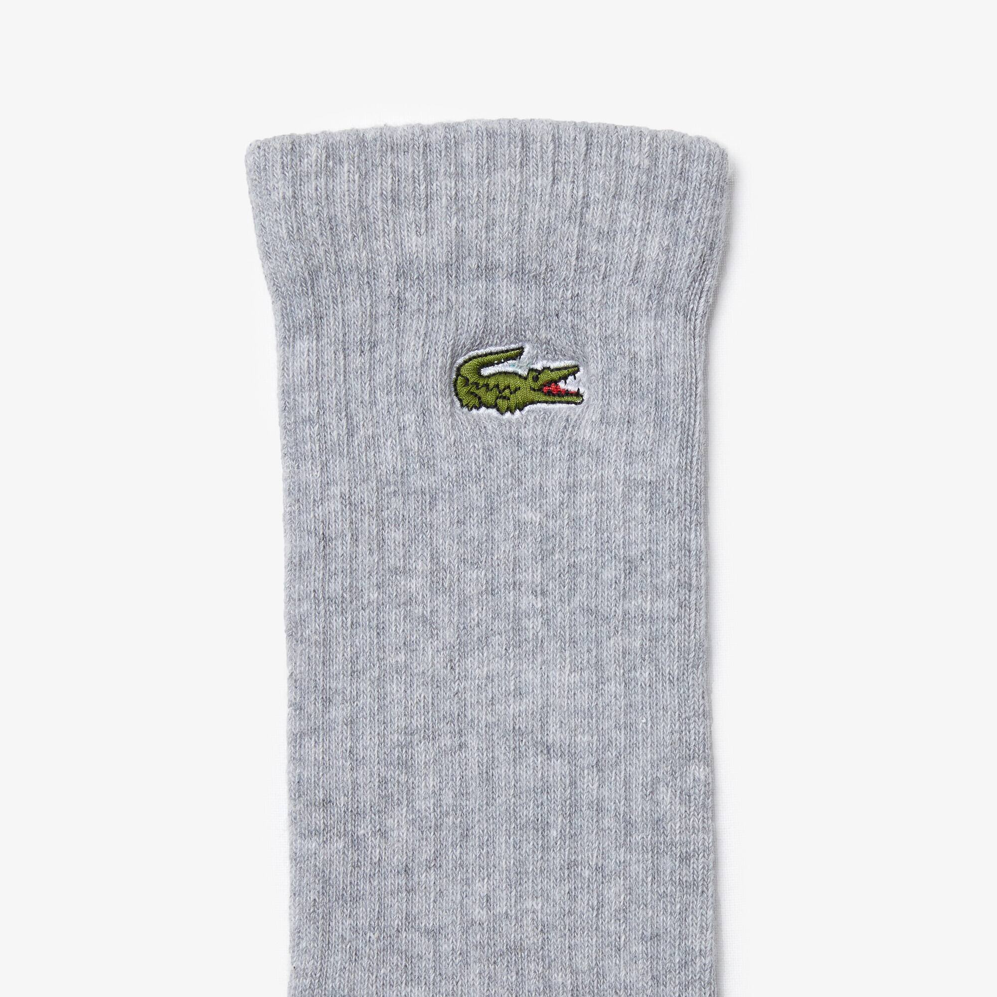 serviette lacoste offerte