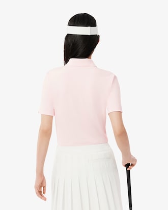 Polo de golf elástico con protección UV y corte entallado para mujer