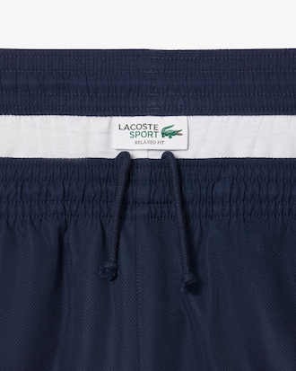 Shorts de tenis ligeros con rayas color block para hombre